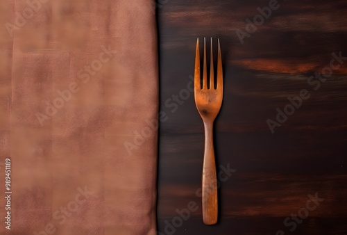 Wooden Fork and Cloth on Dark Background