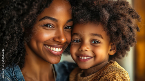 Joyful mother and son embracing at home, smiling, black afro american family, loving and affectionate connection, warm family dynamic, happy moment, parent-child bond, cozy indoors, familial love