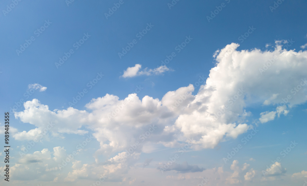 A clear blue sky with fluffy white clouds, perfect for nature themes or backgrounds. Ideal for relaxation, travel, and seasonal imagery. A clear blue sky with fluffy white clouds, perfect for nature themes or backgrounds. Ideal for relaxation, travel, and seasonal imagery.