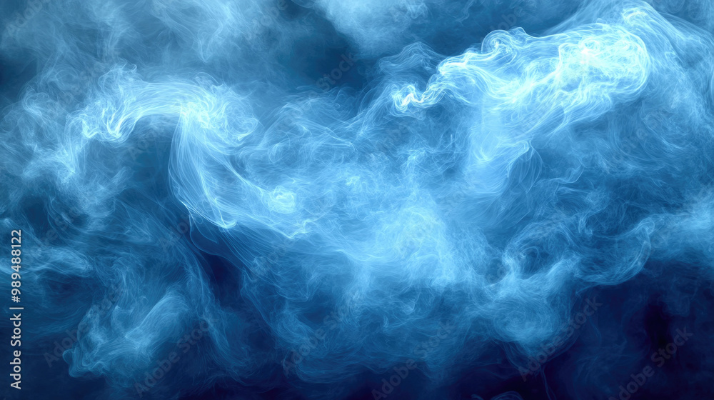 Obraz premium A mesmerizing cloud of blue smoke twists and turns elegantly, creating fluid shapes in the dark atmosphere