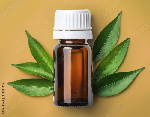 Herbal medicine bottle with some fresh leaves beside it isolated on minimalist background