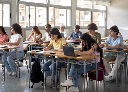 Group of diverse teenage students during a class. Education, students in class