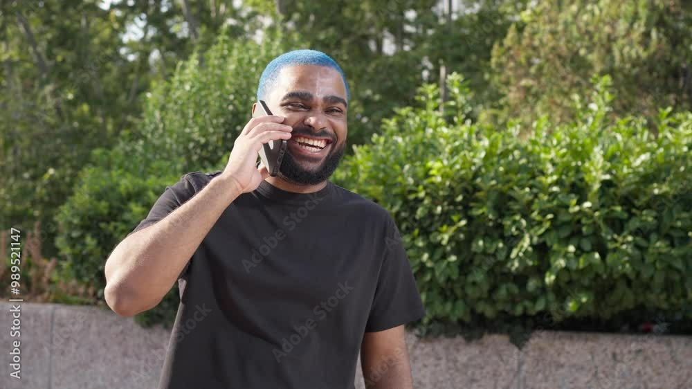 african american man laughing using a smartphone talking to a friend on the phone. close up happy guy at mobile phone with friend smartphone communication.MOV african american man laughing using a smartphone talking to a friend on the phone. close up happy guy at mobile phone with friend smartphone communication.MOV