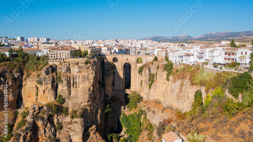 Aerial photo from drone to Puente Nuevo (The New Bridge)  over Guadalevin River in Ronda medieval town sunset. Ronda, Andalusia, Spain.