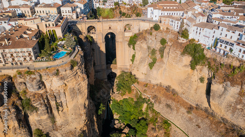 Aerial photo from drone to Puente Nuevo (The New Bridge)  over Guadalevin River in Ronda medieval town sunset. Ronda, Andalusia, Spain.