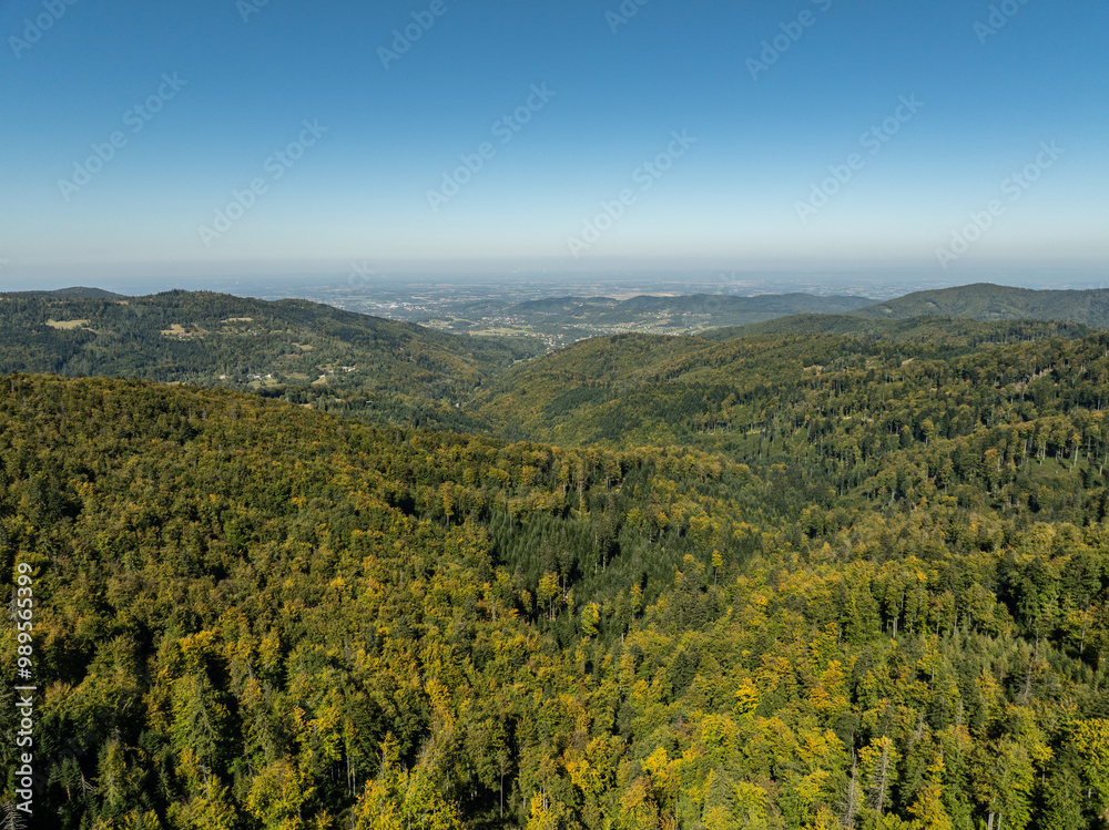 Fototapeta premium Beskid Maly aerial panorama of potrojna hill and czarny gron.Little Beskids mountain range in summer.Aerial drone view of Rzyki Village in Beskid Maly Poland.Czarny gron ski resort in Rzyki.