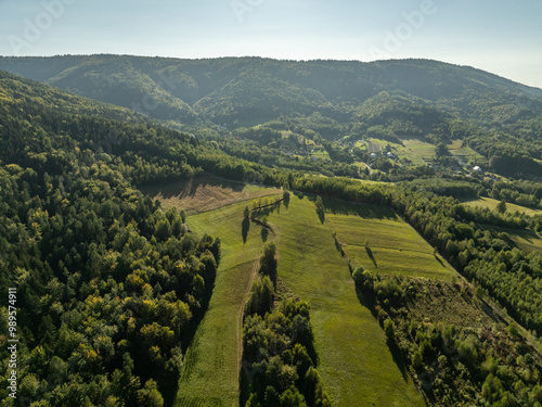 Beskid Maly aerial panorama of potrojna hill and czarny gron.Little Beskids mountain range in summer.Aerial drone view of Rzyki Village in Beskid Maly Poland.Czarny gron ski resort in Rzyki. photo