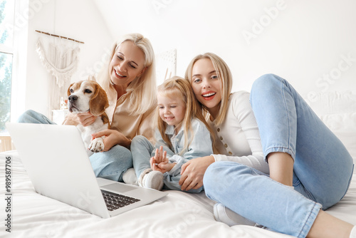 Happy family with cute dog ...