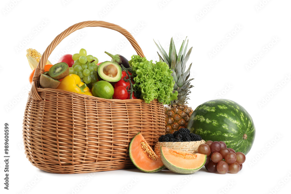 Different fresh vegetables and fruits in wicker basket isolated on white Different fresh vegetables and fruits in wicker basket isolated on white