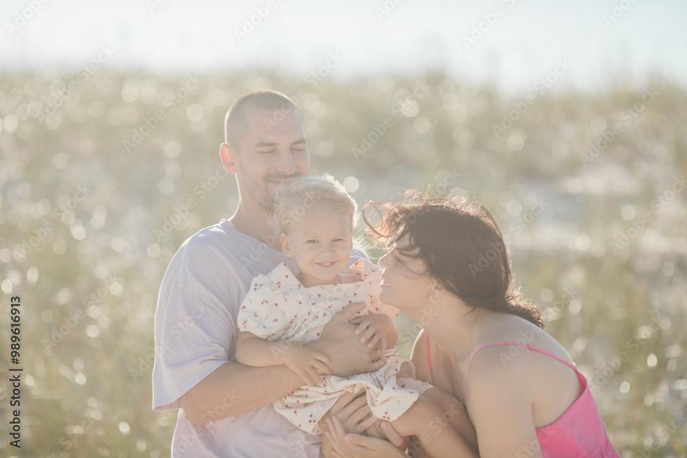 Cheerful family with father, mother, daughter Cheerful family with father, mother, daughter