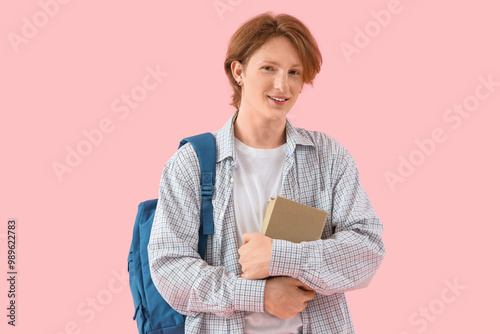 Redhead male student with b...