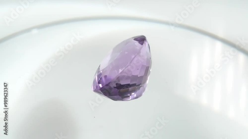 Exquisite Amethyst Gemstone Displayed on a Reflective Surface