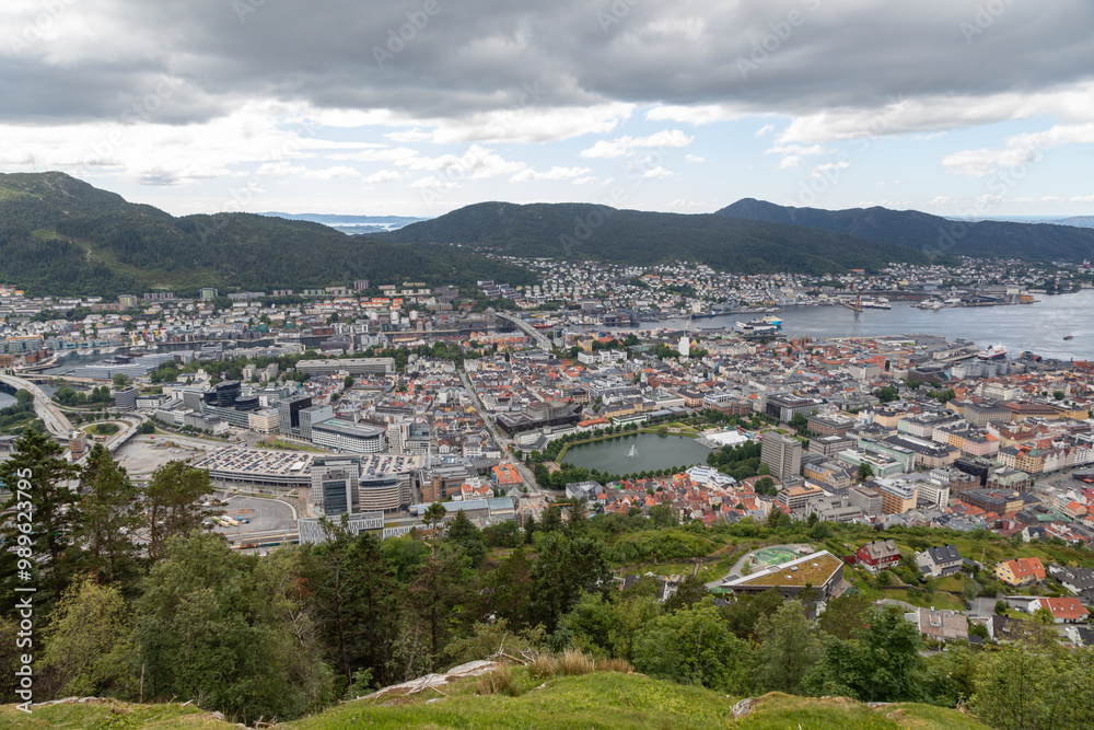 Fototapeta premium Panoramic View of the City and Mountains surrounding Bergen Norway from Atop Mount Fløyen at the Fløibanen Funicular Station