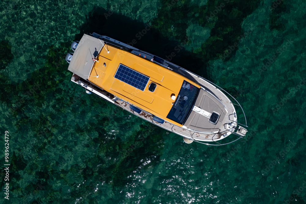 Fototapeta premium drone view of a luxury motor yacht in a beautiful clear sea.