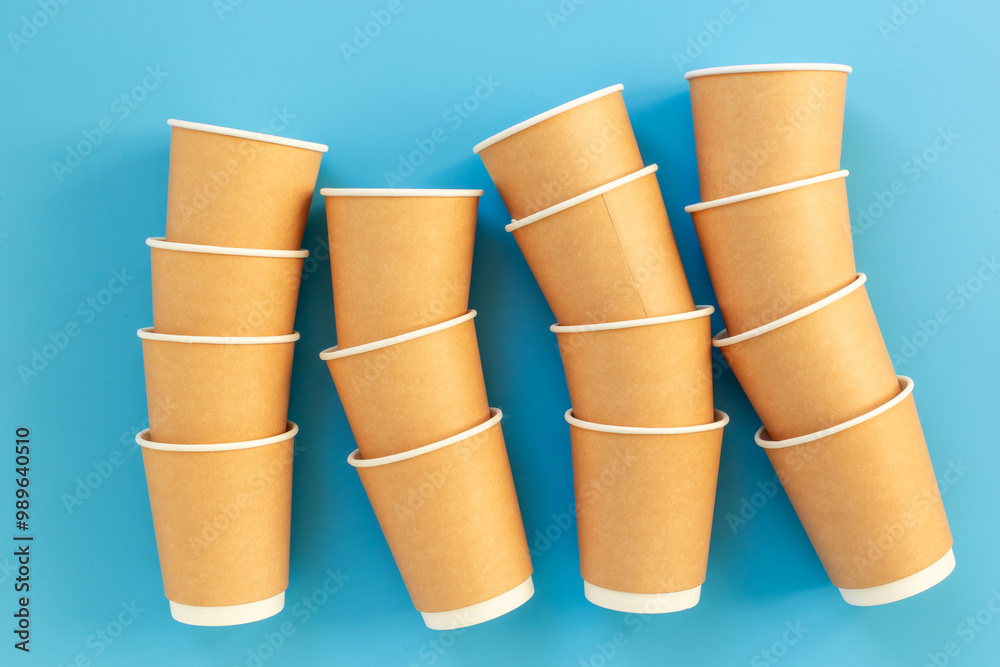 Stack of recyclable coffee paper cups, top view. Eco-friendly zero waste products