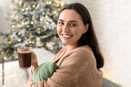 Happy young woman with glas...