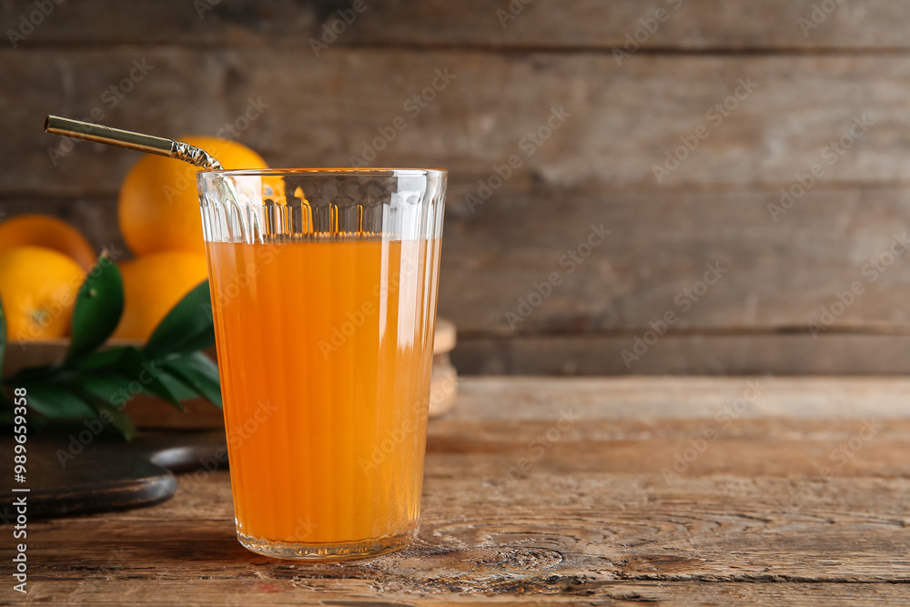 Glass of fresh orange juice and fruits on wooden background Glass of fresh orange juice and fruits on wooden background