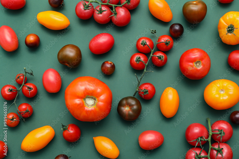 Different fresh tomatoes on green background Different fresh tomatoes on green background