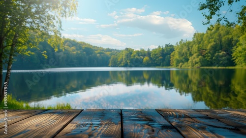Empty wooden table top with blurred background of lake and forest in summer