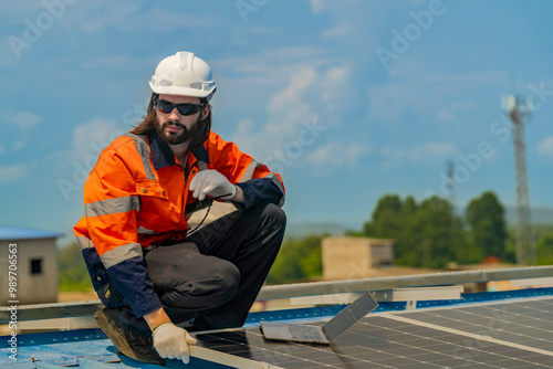 Wallpaper Mural Worker Technicians are working to construct solar panels system on roof. Installing solar photovoltaic panel system. Men technicians walking on roof structure to check photovoltaic solar modules. Torontodigital.ca