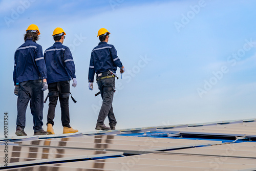 Wallpaper Mural engineer man inspects construction of solar cell panel or photovoltaic cell by electronic device. Industrial Renewable energy of green power. factory worker working on tower roof. Torontodigital.ca
