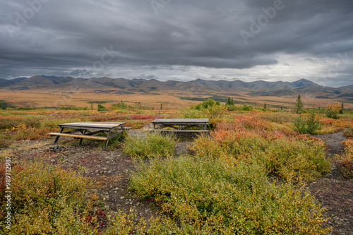 Picnic table beside the Dempster Highway at the Arctic Circle in Yukon Territory, Canada photo