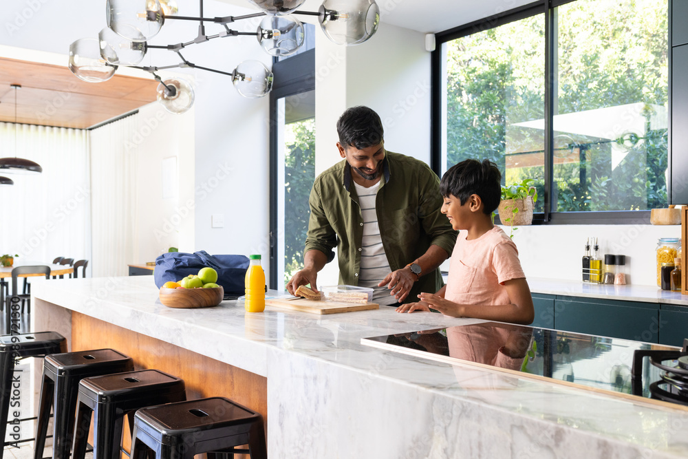 indian father and son preparing breakfast together in modern kitchen, bonding time indian father and son preparing breakfast together in modern kitchen, bonding time