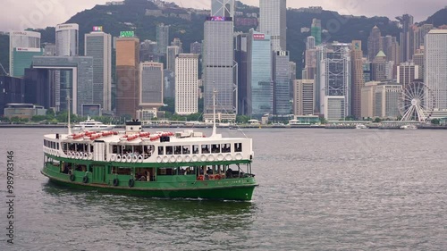 Hong Kong historic star ferry boat in Victoria Harbor, passenger ship from Kowloon island to Hong Kong. Asian modern urban center, China tourism destination.