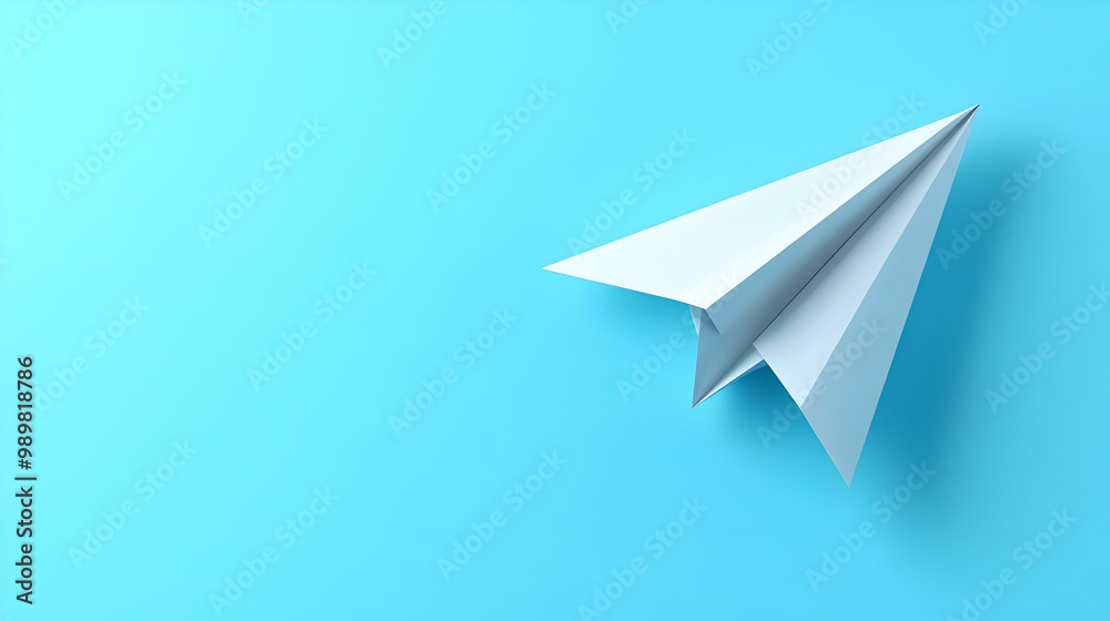 A paper airplane on a vibrant blue background, symbolizing creativity and flight. A paper airplane on a vibrant blue background, symbolizing creativity and flight.