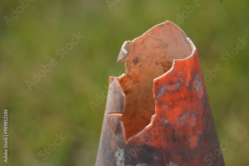 Close up of dirty broken traffic cone tip