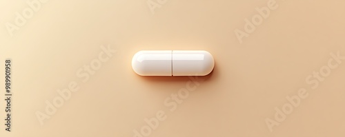 Minimalistic image of a single white capsule on a beige background, representing medicine, healthcare, and pharmaceuticals.