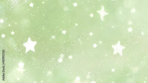 Abstract green background with glowing white stars and bokeh light effects. Space and night sky concept. 4K background material for loop playback