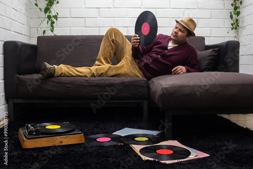 man reviews vinyl records, vintage photography
 photo