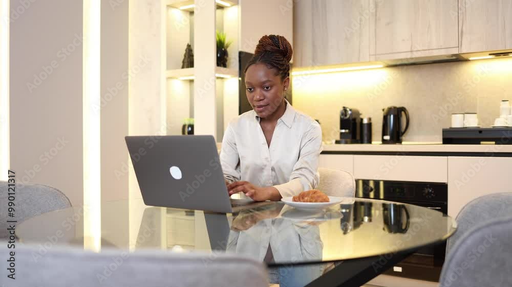Black woman handling online projects from her home office Black woman handling online projects from her home office