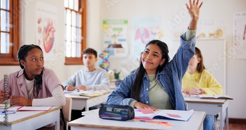 Fotografie Happy girl, students and hands raised with question in classroom for interaction, learning or education at school