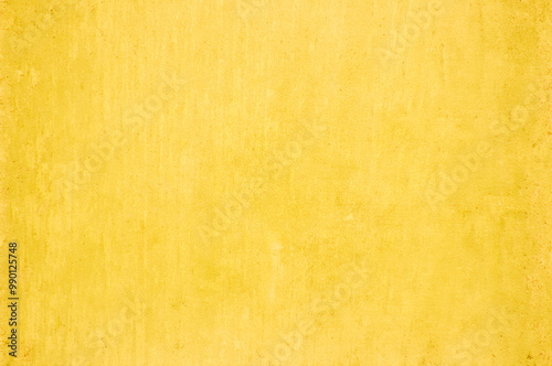 Yellow concrete stone texture for background in summer wallpaper. Cement and sand wall of tone vintage minimal. Concrete abstract wall of light orange color, cement texture white blank for home decor.