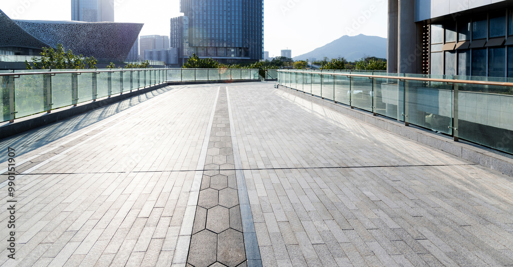 Obraz premium Empty road by the office buildings