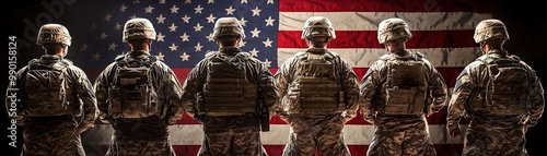 Soldiers Silhouetted Against American Flag Background photo