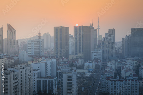 The view from above on the downtown of Qingdao, Shandong, sunset sky with copy space for text