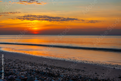 Obraz na płótnie Sandy beach with pebbles of Baltic Sea on Curonian Spit at sunset. Kaliningrad region. Russia w salonie