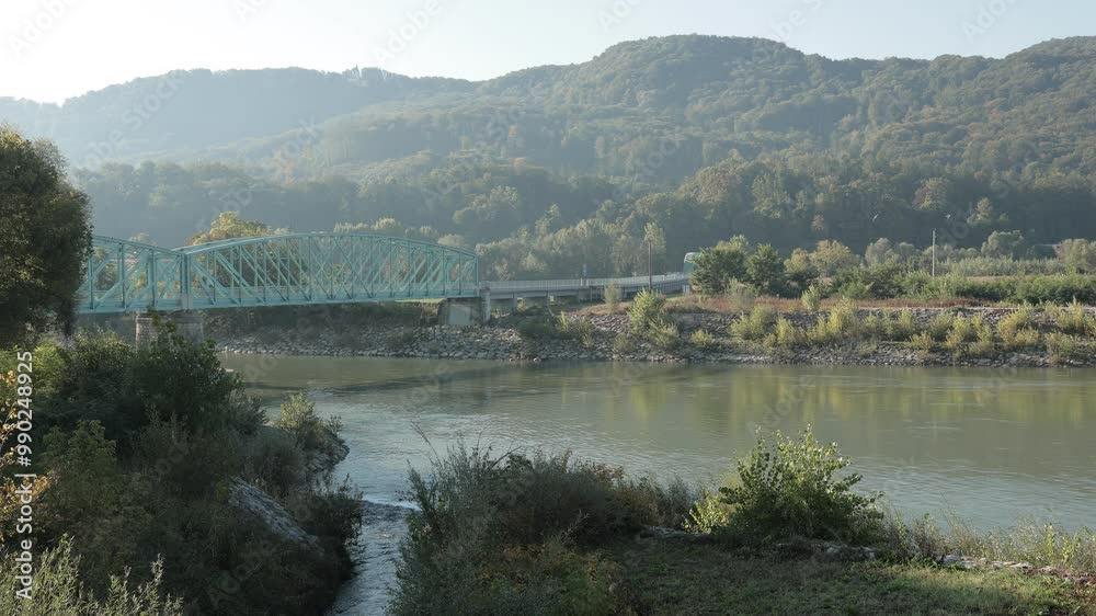 Steel girder bridge leading from Brezice south over Sava and Krka river. Early morning hazy feeling.