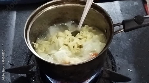 Boil instant noodles in boiling water photo