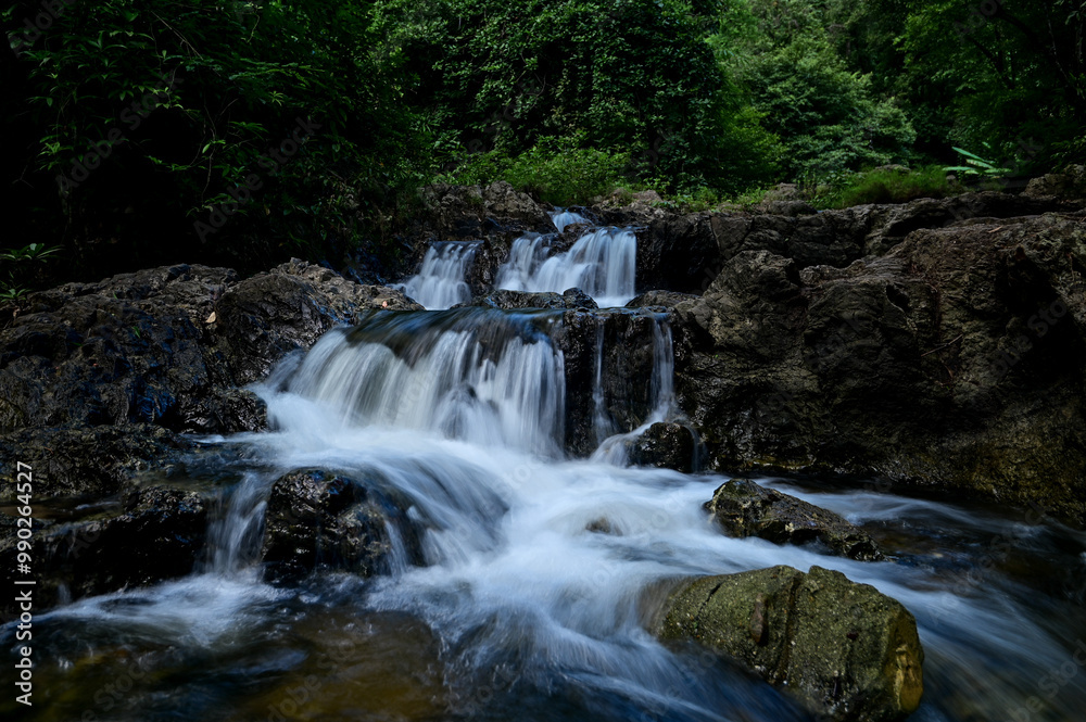 A small waterfall created from water flowing from Khlong Lan Waterfall. In Namtok Khlong Lan National Park Kamphaeng Phet Province A small waterfall created from water flowing from Khlong Lan Waterfall. In Namtok Khlong Lan National Park Kamphaeng Phet Province