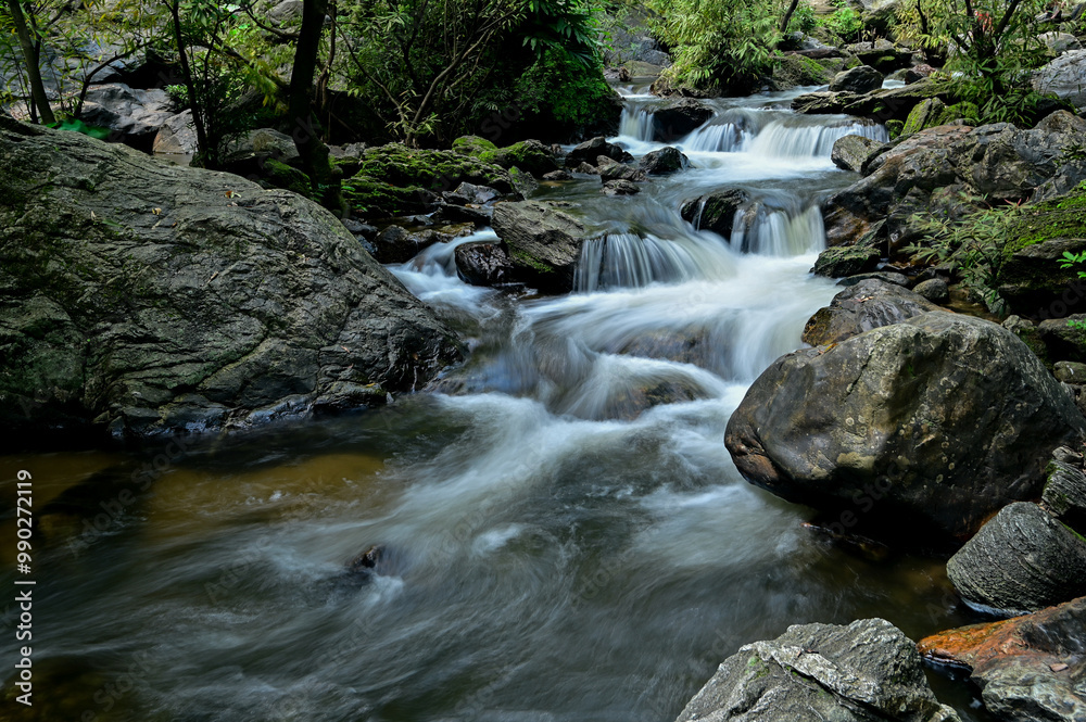 A small waterfall created from water flowing from Khlong Lan Waterfall. In Namtok Khlong Lan National Park Kamphaeng Phet Province A small waterfall created from water flowing from Khlong Lan Waterfall. In Namtok Khlong Lan National Park Kamphaeng Phet Province