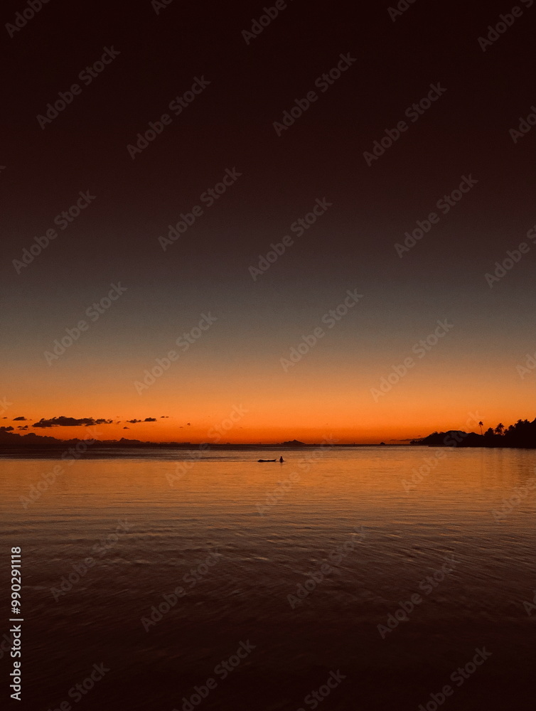 Naklejka premium Tranquil sunset over the ocean on Bora Bora, French Polynesia