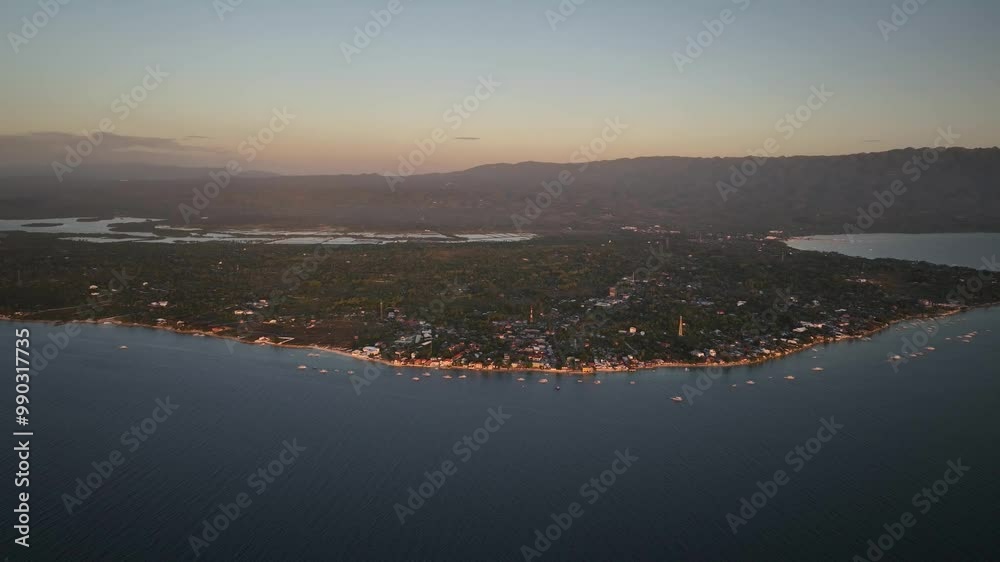 Aerial View Of Moalboal At Dawn With Scenic Mountain Views In Cebu, Philippines. Aerial View Of Moalboal At Dawn With Scenic Mountain Views In Cebu, Philippines.