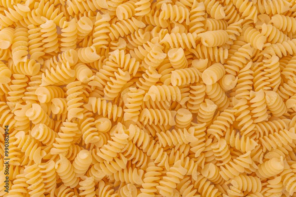 Spiral pasta background. Light wheat fusilli. Spiral pasta background. Light wheat fusilli.