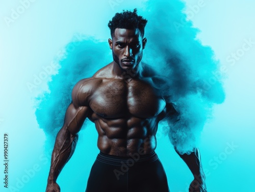 A muscular man stands confidently against a vibrant blue background, showcasing strength and fitness, with a dynamic cloud of color behind him.