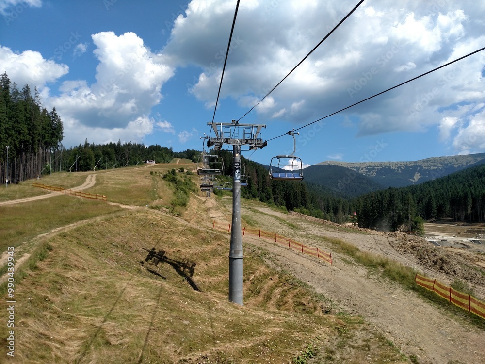 Chairlift ski lift in Bukovel Carpathians mountains Ukraine cableway extreme sport recreation concept cable car horizontal Chairlift ski lift in Bukovel Carpathians mountains Ukraine cableway extreme sport recreation concept cable car horizontal