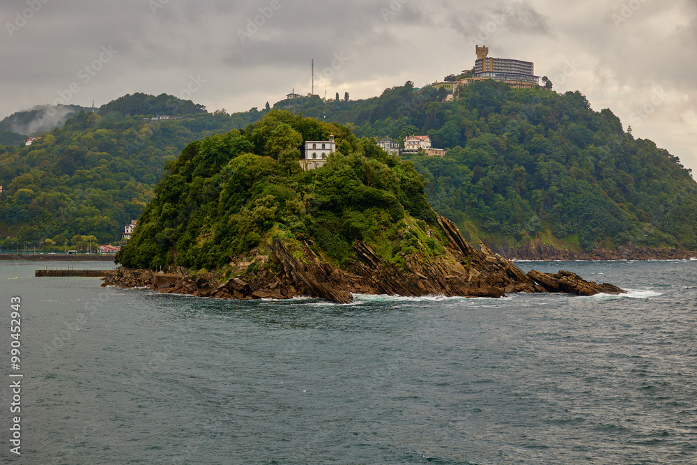 Santa Clara island on background of Monte Igualdo mountain in San Sebastian, Spain Santa Clara island on background of Monte Igualdo mountain in San Sebastian, Spain